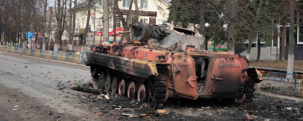 A destroyed armored personnel carrier stands in the central square of the town of Makariv, 60 kilometres west of Kyiv, Ukraine, after a heavy night battle Friday, March 4, 2022. (AP Photo/Efrem Lukatsky)