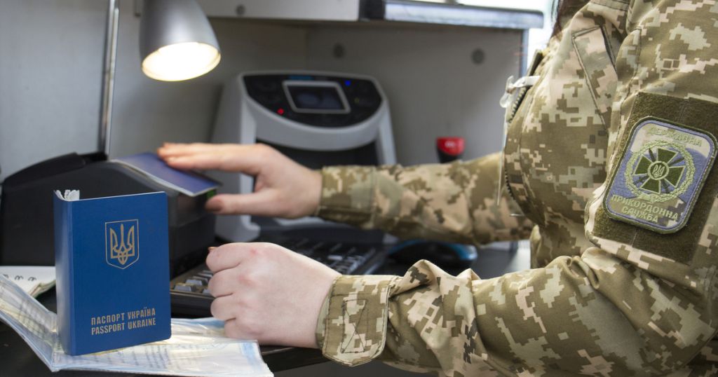 Border Control. The process of scanning a ukrainian passport doc